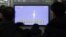 South Koreans watch a television broadcast reporting the country's first rocket launch at Seoul Railway Station in Seoul, South Korea, January 30, 2013.