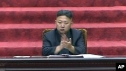  North Korean leader Kim Jong Un claps hands during the Supreme People's Assembly's second meeting of the year, in Pyongyang, North Korea, September 25, 2012..