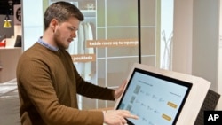 Andreas Flygare, the project manager for the new Warsaw Ikea store presents a system projecting furniture interior a wall, in Warsaw, Poland, Nov. 22, 2018.