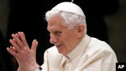 Pope Benedict XVI arrives for his weekly general audience at the Paul VI Hall at the Vatican, Feb. 13, 2013. 