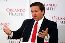 FILE - Florida Gov. Ron DeSantis speaks at a news conference at Orlando Regional Medical Center, June 23, 2020, in Orlando, Fla.