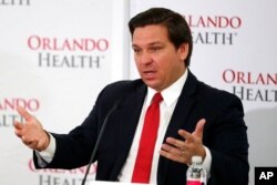 FILE - Florida Gov. Ron DeSantis speaks at a news conference at Orlando Regional Medical Center, June 23, 2020, in Orlando, Fla.
