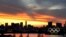 The Olympic rings are seen in front of the skyline during sunset, in Tokyo, Japan, July 20, 2021. 