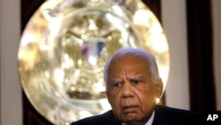 FILE - In this Dec. 24, 2013 file photo, Egyptian interim Prime Minister Hazem el-Beblawi speaks during a news conference at the headquarters of the Egyptian prime ministry in Cairo, Egypt.