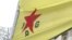 FILE - A of the YPG, a Syria-based Kurdish militant group. Turkish police reportedly arrested two british men on suspension of doing propaganda on behalf of the Kurdistan Workers’ Party, PKK, and the Syrian Kurdish militia group, the People’s Protection Units, or YPG.