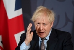 FILE - British Prime Minister Boris Johnson holds a news conference in Downing Street on the outcome of the Brexit negotiations, in London, Britain, Dec. 24, 2020.