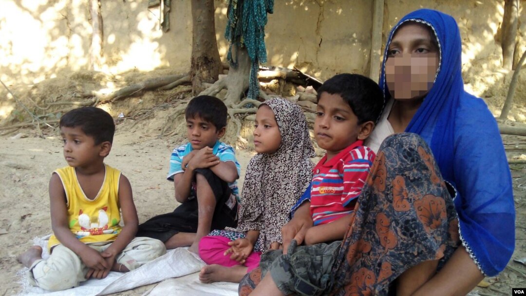 FILE - To escape violence in Rakhine state during the military crackdown there, in November 2016, Rohingya woman Haresa Begum fled to Bangladesh with her four children, leaving her husband in Myanmar. 