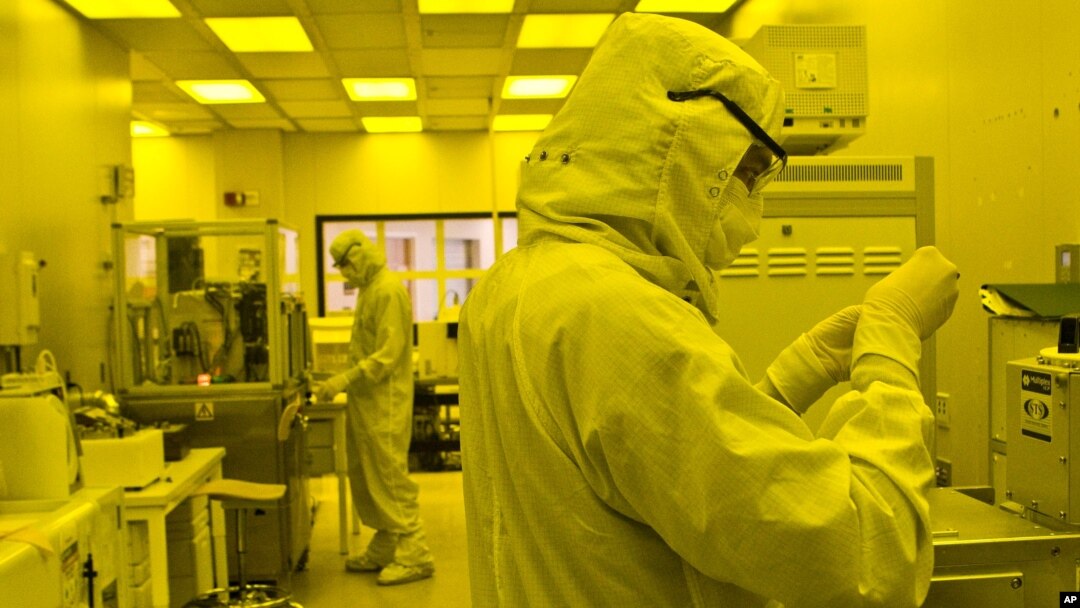 Researchers work in a clean room at the expanded University of Michigan Lurie Nanofabrication Facility in Ann Arbor, Michigan, April 10, 2008.