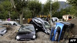 This general view shows a pile of vehicles on a street in Breil-sur-Roya, south-eastern France, on October 4, 2020, after extensive flooding caused widespread damage in the Alpes-Maritimes departement.