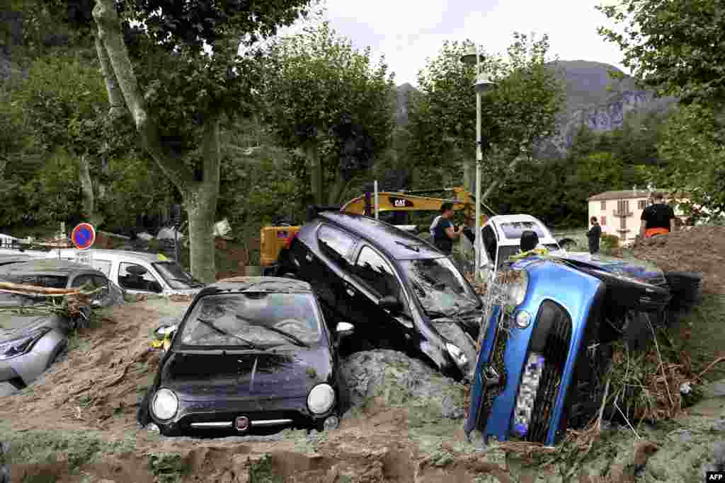 A pile of vehicles are seen on a street in Breil-sur-Roya, south-eastern France after extensive flooding caused widespread damage.