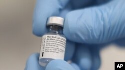 A vial of the Pfizer-BioNTech COVID-19 vaccine at the Royal Victoria Hospital in Belfast, Dec. 8, 2020. 