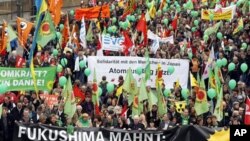 Anti-nuclear demonstrators march in Cologne, western Germany, March 26, 2011, to protest against nuclear power