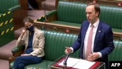 A video grab from footage broadcast by the UK Parliament's Parliamentary Recording Unit (PRU) shows Britain's Health Secretary Matt Hancock updating MPS on the status of the Coronavirus pandemic at the House of Commons in London, May 27, 2021.