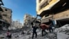 Palestinian first responders remove a body from the rubble of a building hit by an Israeli strike in Beit Lahia, in the northern Gaza Strip, Oct. 29, 2024.