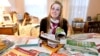 FILE - Kim Pollock, 17, facing center, goes through college materials, with the help of her sister Lindsay, 15, back left, in her bedroom in Bedford, N.H. 