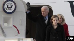 A woman wipes away a tear as she watches the funeral of Whitney Houston near the Hope Baptist Church in Newark, New Jersey February 18, 2012. Houston died February 11 in Beverly Hills, California, at the age 48. (REUTERS)