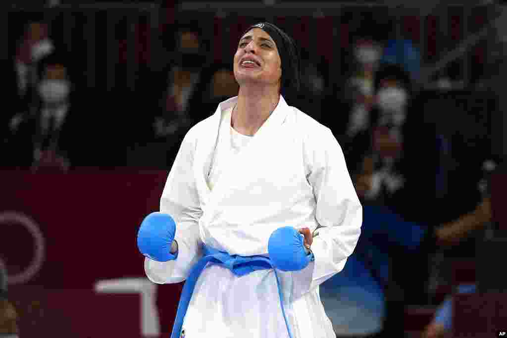 Feryal Abdelaziz of Egypt reacts after winning her women&#39;s kumite +61kg gold medal bout for karate at the 2020 Summer Olympics, Saturday, Aug. 7, 2021, in Tokyo, Japan. (AP Photo/Vincent Thian)