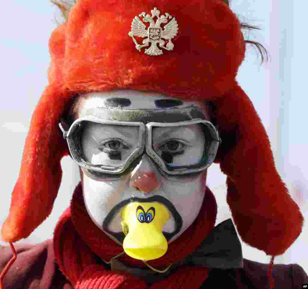 An actor performs at the Olympic Park at the 2014 Winter Olympics in Sochi, Russia. 