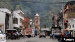 People walk on a street in Cajamarca, Colombia, Aug. 26, 2016. Picture taken August 26, 2016. Mining at AngloGold Ashanti's La Colosa project in Tolima province would be banned if Cajamarca municipality follows the lead of nearby Piedras, whose residents voted to ban extraction amid water quality fears.