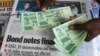 FILE:A street vendor poses with new bond notes in the capital Harare, Zimbabwe, November 28, 2016. REUTERS/Philimon Bulawayo - RTSTN0S