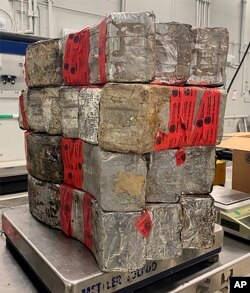 This undated photo provided by the U.S. Customs and Border Protection shows seized drug bundles containing 132 pounds of methamphetamine on display from Feb. 25, 2021, at the Laredo port of entry.