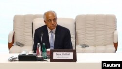 FILE - Zalmay Khalilzad, U.S. envoy for peace in Afghanistan, is seen before talks between the Afghan government and Taliban insurgents in Doha, Qatar, Sept. 12, 2020. Khalilzad returned this week to Doha to press for progress in the talks.