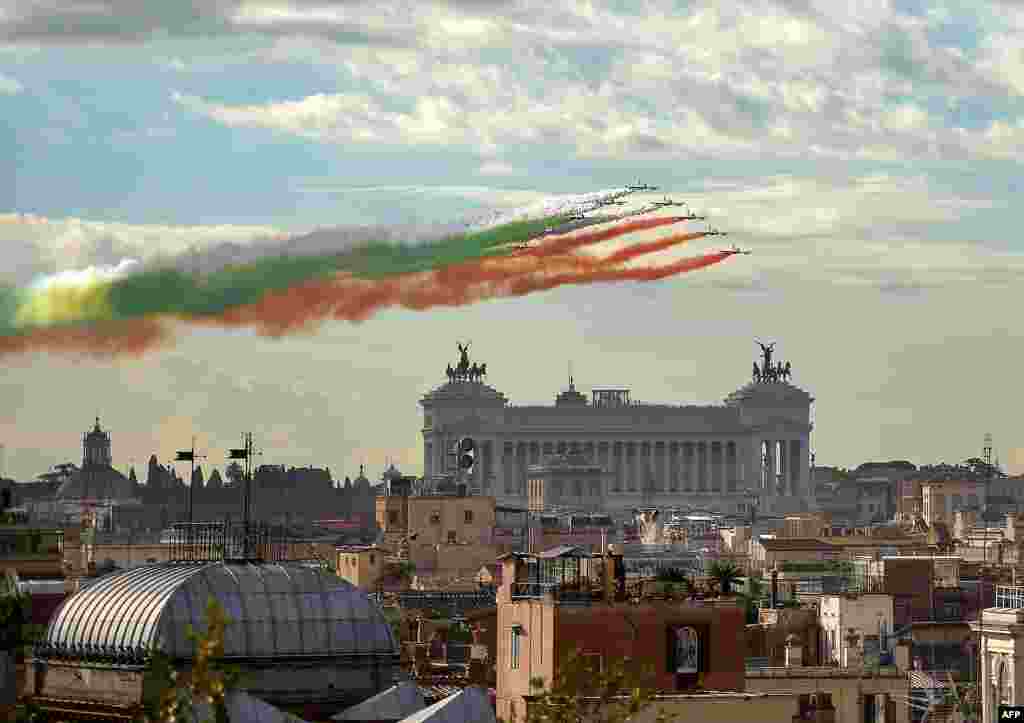 The Italian Air Force aerobatic unit Frecce Tricolori spreads green, white and red smoke in the colors of the Italian flag marking the day of National Unity and Armed Forces in Rome.