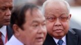 Cambodia's Senate President Chea Sim, right, looks on as his attends a water festival in Phnom Penh, Cambodia, file photo. 