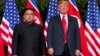 FILE - U.S. President Donald Trump, right, meets with North Korean leader Kim Jong Un on Sentosa Island, in Singapore, June. 12, 2018. 