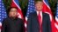 FILE - U.S. President Donald Trump, right, meets with North Korean leader Kim Jong Un on Sentosa Island, in Singapore, June. 12, 2018.