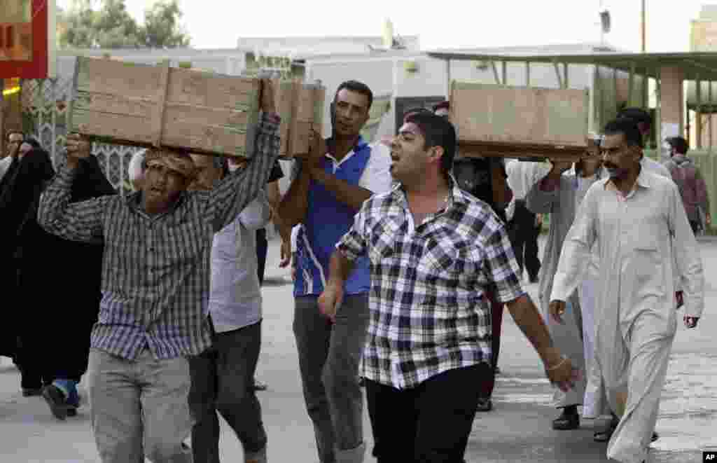 Bombing victims are taken for burial in the Shiite holy city of Najaf, Sept. 15, 2013.