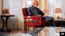 Former President of Afghanistan Hamid Karzai speaks during an interview with the Associated Press in Kabul , Afghanistan on Dec. 10, 2021.