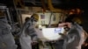 Employees of Tokyo Electric Power Company Holdingstake AP journalists to the area under the Unit 5 reactor pressure vessel, which survived the earthquake-triggered tsunami in 2011, at the Fukushima Daiichi nuclear power plant in Futaba town, northeastern Japan, on Feb. 20, 2025. 