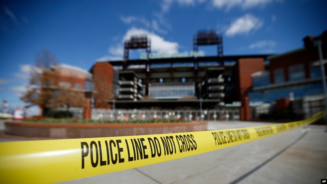 Police tape blocks an entrance to Citizens Bank Park, home of the Philadelphia Phillies baseball team, March 24, 2020, in Philadelphia.