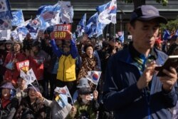 Anti-government activists attend a rally in central Seoul, Oct. 9, 2019.