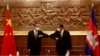 Chinese Foreign Minister Wang Yi, left, greets with Cambodian counterpart Prak Sokhonn in Phnom Penh, Cambodia, Sept. 12, 2021.