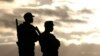 FILE - Police officers stand guard during a political rally addressed by Zimbabwe president Robert Mugabe (not pictured) in Bindura, north of the capital Harare, July 8, 2016. 