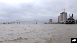 FILE - A view of the Mississippi River as Tropical Storm Barry approaches land in New Orleans, Louisiana, U.S. July 12, 2019. A new report says U.S. cities, like New Orleans, that set goals to slash greenhouse emissions lack the data to measure progress.