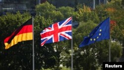 Flags of Britain, Germany and the European Union flutter ahead of the arrival of German Chancellor Olaf Scholz and British Prime Minister Keir Starmer, in Berlin, Germany Aug. 28, 2024. 