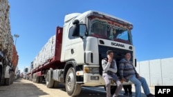 Trucks carrying humanitarian aid line up on the Egyptian side of the Rafah border crossing with the Gaza Strip on March 2, 2025, after Israel suspended the entry of supplies into the Palestinian enclave.