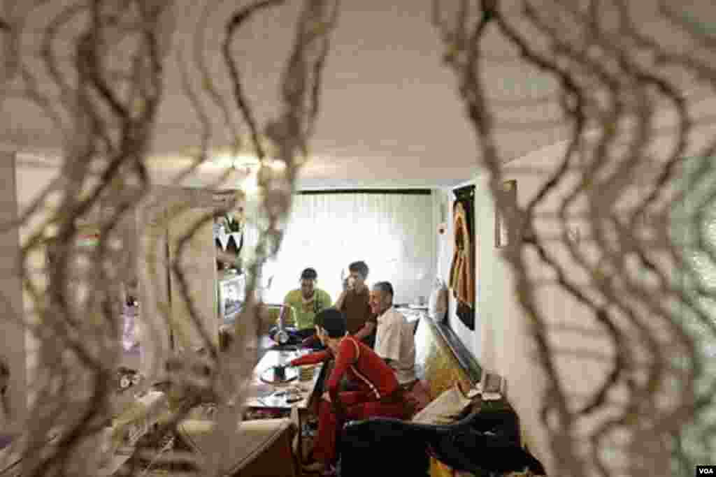 Bosnian Muslim members of the Mujezinovic family celebrate Eid inside their home in the village of Vranduk, north from the Bosnian capital of Sarajevo, Aug. 30,2011. AP