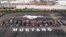 Photo provided by the Ford Motor Co., shows Mustang vehicles parked to spell out "10,000,000" on a parking lot at the Flat Rock Assembly plant, Aug. 8, in Flat Rock, Mich. 