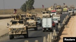 A convoy of U.S. vehicles is seen after withdrawing from northern Syria, on the outskirts of Dohuk, Iraq, Oct. 21, 2019. 