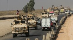 A convoy of U.S. vehicles is seen after withdrawing from northern Syria, on the outskirts of Dohuk, Iraq, Oct. 21, 2019.
