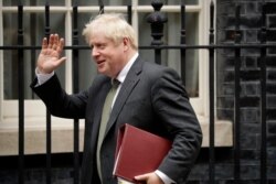 British Prime Minister Boris Johnson leaves 10 Downing Street in London, Sept. 23, 2020.