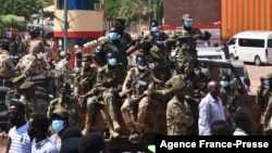 Sudanese security forces protect a military hospital and government offices during protests against a military coup overthrowing the transition to civilian rule, Oct. 25, 2021 in the capital's twin city of Omdurman.