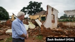 FILE - Stephen O’Brien, the U.N.’s top humanitarian official, looks over the main mosque in Bangassou, Central African Republic, that was burned down and destroyed during attacks in May 2017.