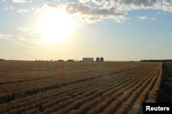 FILE - Grain silos are seen on the horizon near Moree, Australia, October 28, 2020. (REUTERS/Jonathan Barrett/File Photo)