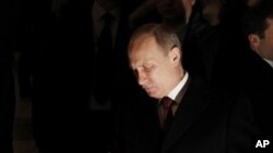 Russian Prime Minister and presidential candidate Vladimir Putin casts his ballot in Moscow on Sunday, March 4, 2012. 