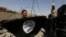 A member of Iraqi Counter Terrorism Service holds an Islamic State militant flag as he celebrates in the Old City of Mosul, Iraq July 9, 2017. 